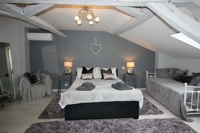 Bedroom 1 (first floor) with king size and single beds - a lovely spacious, beamed room