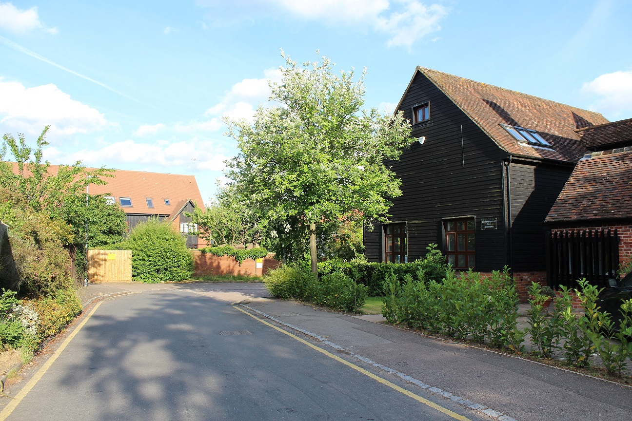 Parking area directly ahead - spaces for 2 cars per apartment