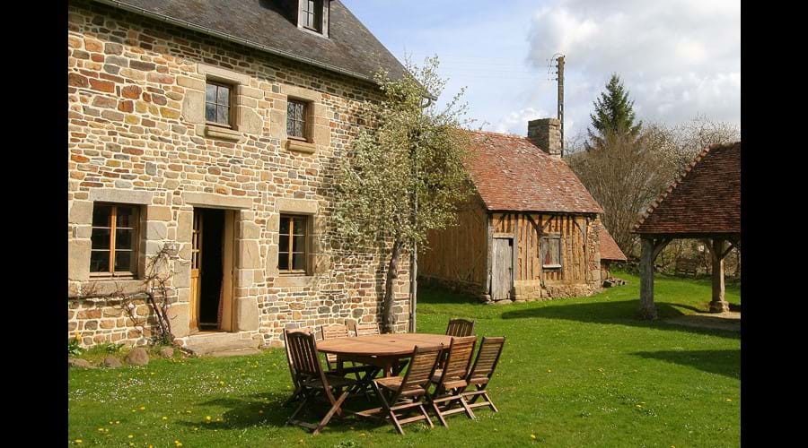 Communal eating in the garden. The Bakehouse to the right of the picture is where communal bikes are stores for your use