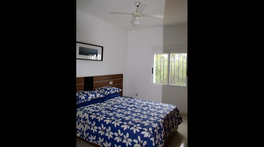 Master Bedroom with both air con and a ceiling fan
