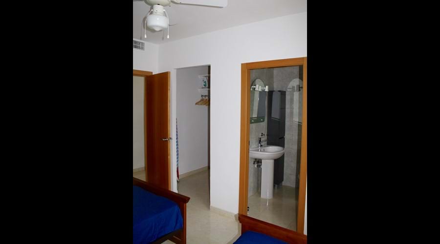 Twin Bedroom with walk in wardrobe and leading to en-suite shower room