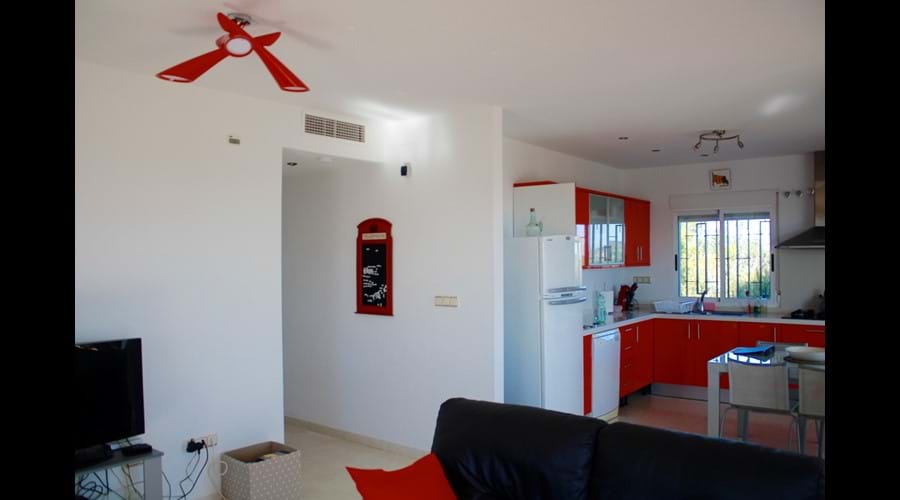 Lounge across to the kitchen and the hall to the bedrooms and additional toilet
