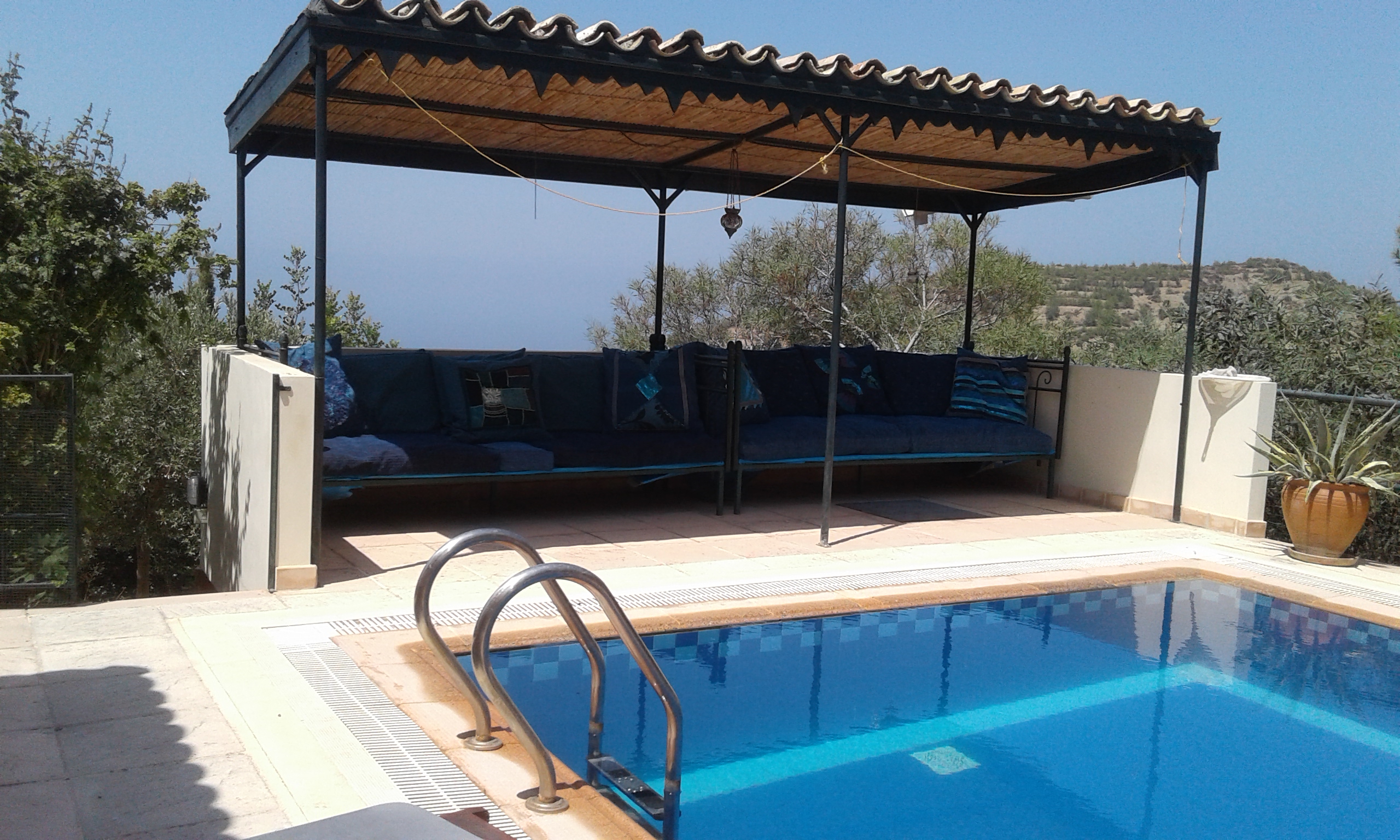 The pool with comfortable covered seating area