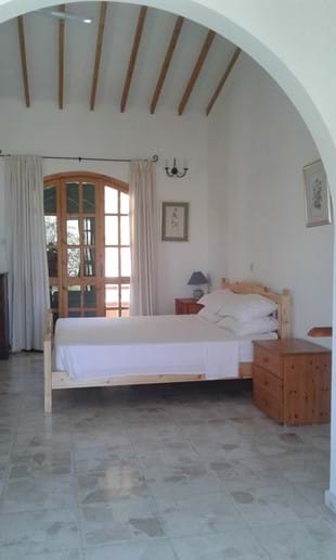 The master bedroom with superking bed. Windows and French windows on 3 aspects.