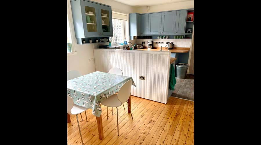 Dining area with extendable table adjacent to the kitchen