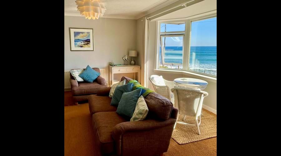 Large, spacious lounge with open fire. Smart TV with freesat and apps, blue-ray/DVD player and WII games console. Plenty of seating and that view!