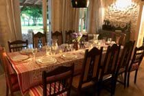 View of dining room table with twelve place settings