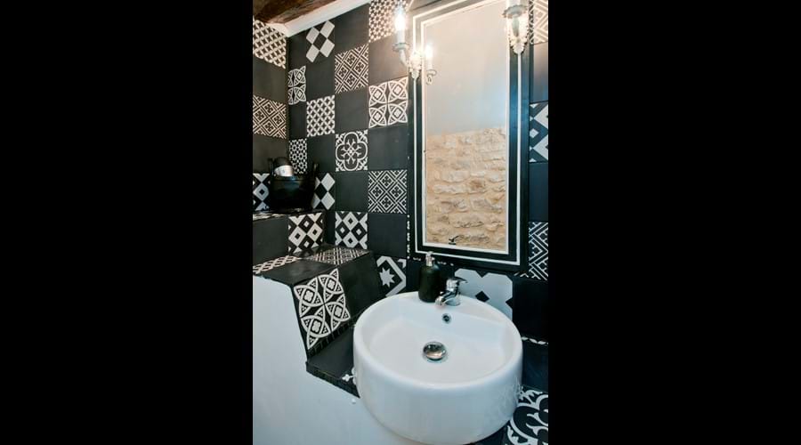 En suite bathroom in the Black and White Room of  Maison Pouyteaux