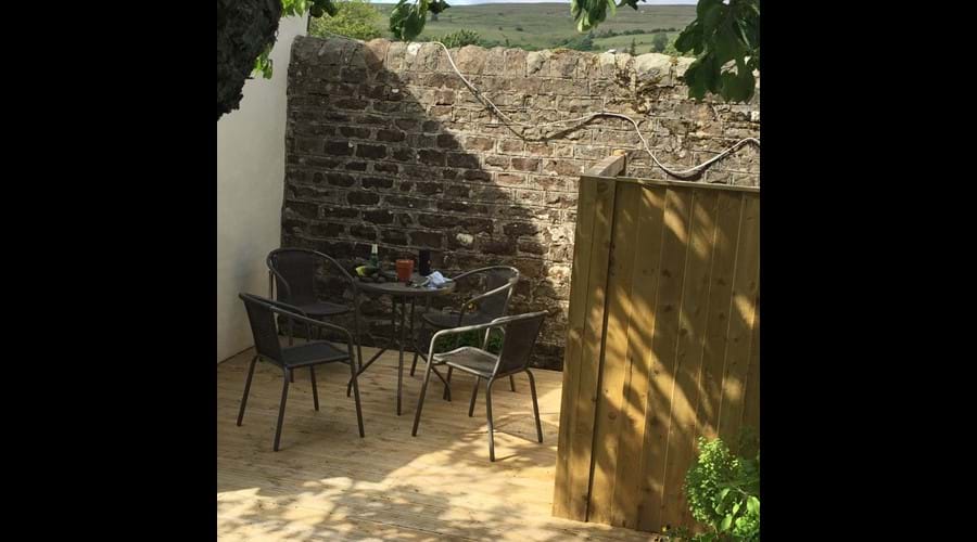Decked area provides a sun trap and outdoor dining space