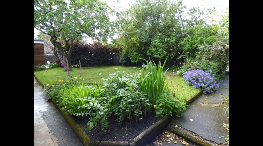 The front garden offers a place to enjoy the sun and relax outdoors