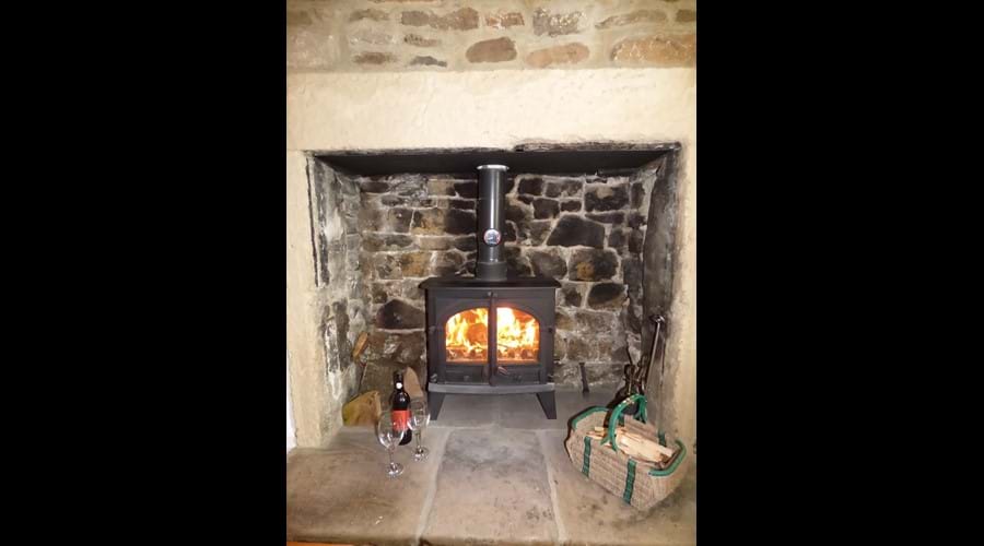 Beautiful fireplace and log burner in the main living room