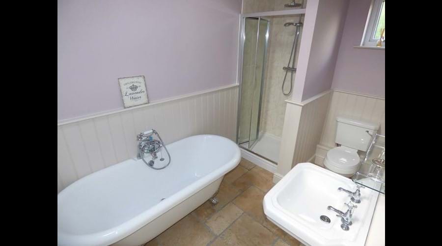 Luxury bathroom with rolltop bath and walk in shower