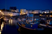 Harbour & cottage at night