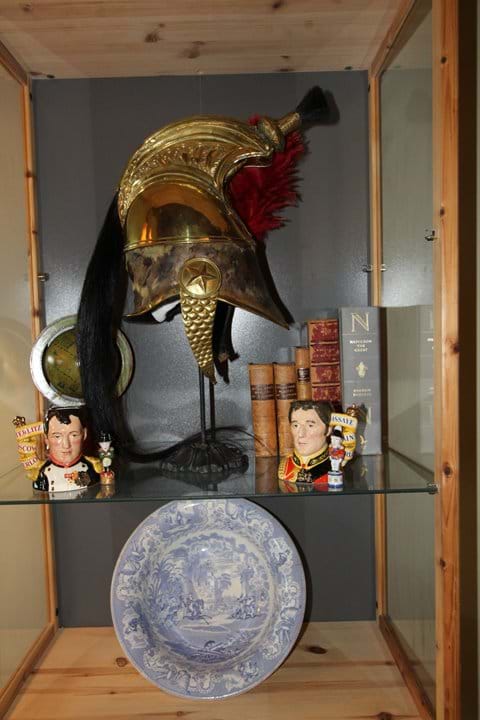A selection of antiques adorn the shelves
