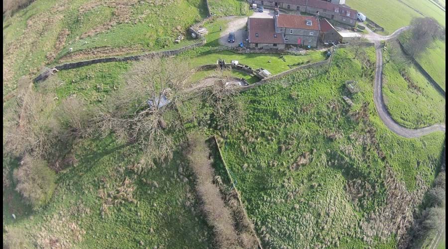 Drone photo of garden, bunkbarn and attached farmhouse