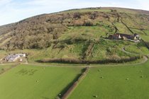 Drone photo of Bank House Farm, traditional buildings and cowsheds 1/3 mile distant