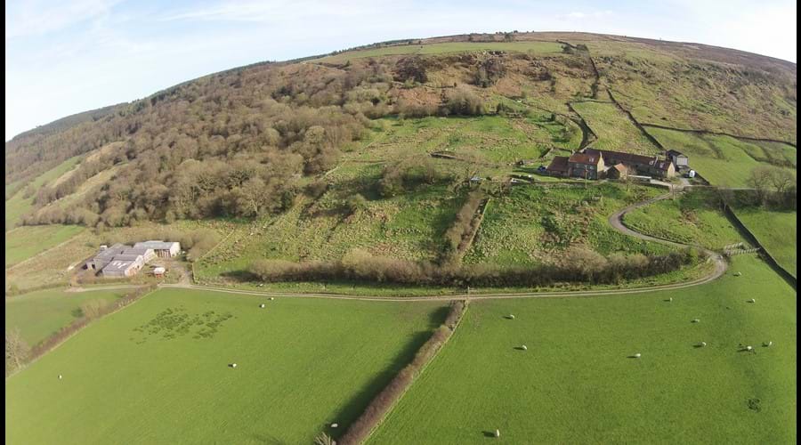 Drone photo of Bank House Farm, traditional buildings and cowsheds 1/3 mile distant