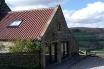 Luxury bunkbarn entrance & common room window