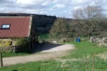 Parking area in front of luxury bunkbarn entrance