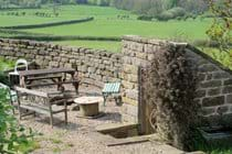 Fire pit near old privvy, luxury bunkbarn