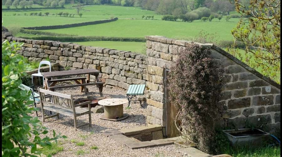 Fire pit near old privvy, luxury bunkbarn