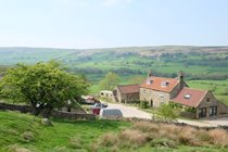 View of luxury bunkbarn from field above