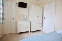 Ample storage and TV in every bedroom