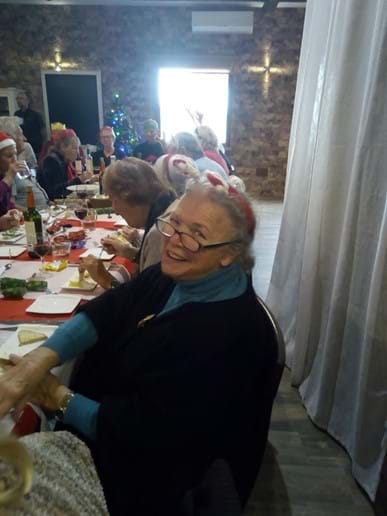 Barbara enjoying her Christmas lunch with the group