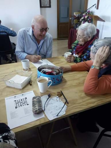 Ian, Lynne and Barbara finding their crossword challenge amusing!