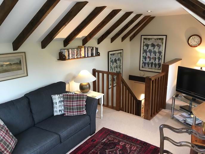 Leat Cottage sitting room and stairs down to kitchen and bedroom