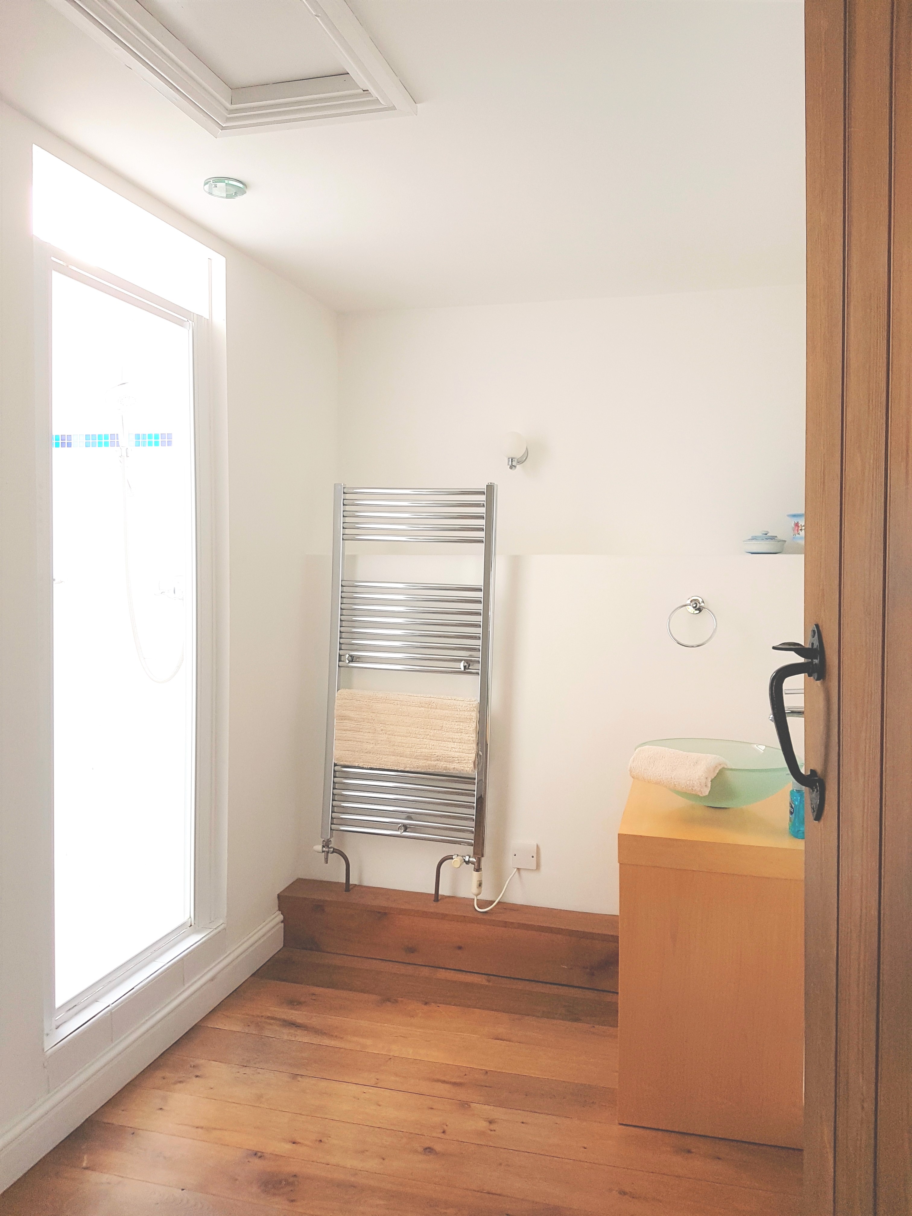 Large, contemporary bathroom.  Please note there is a 6 inch step up into the shower enclosure (no bath)