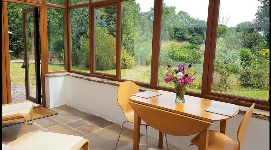 Dine in the sun room or relax in the easy chairs while you watch the garden wildlife.