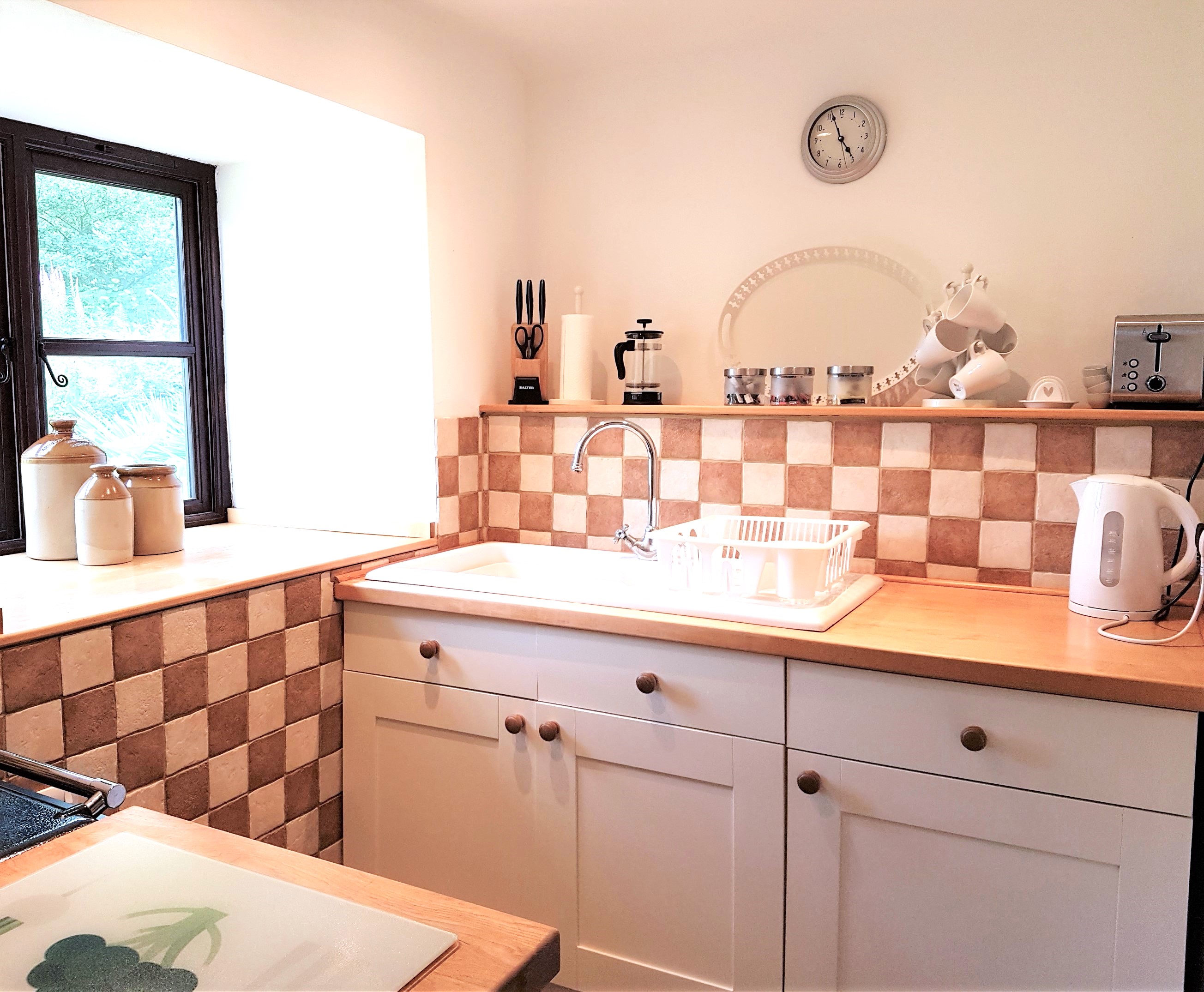 Kitchen with walk-in larder.  Fridge, separate freezer, microwave oven, washer drier and dishwasher are provided.