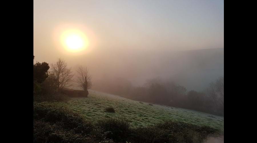 A misty winter's sunrise at Great Hills Lodge