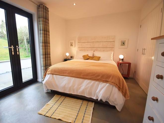 Double bedroom with French doors to terrace