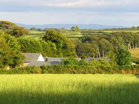 Gallery Cottages nestled in the countryside with Dartmoor in the distance