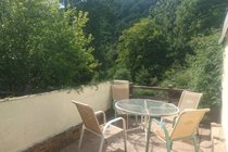 the patio across the road overlooking the river