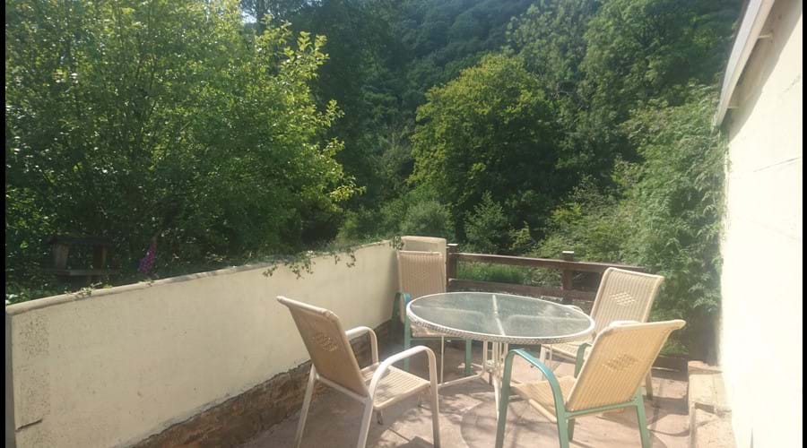 the patio across the road overlooking the river