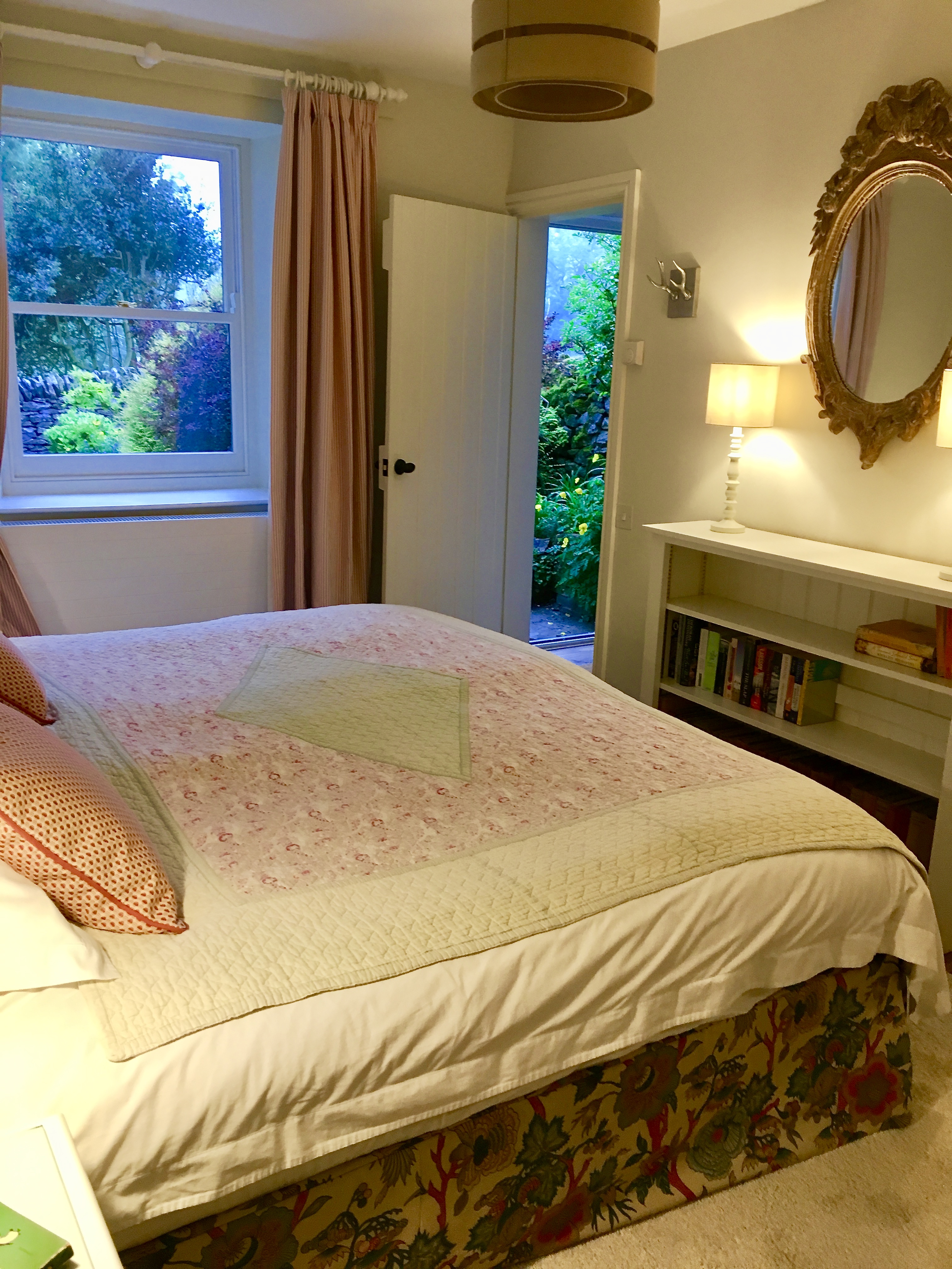 Ground floor bedroom with super king-size bed and garden views