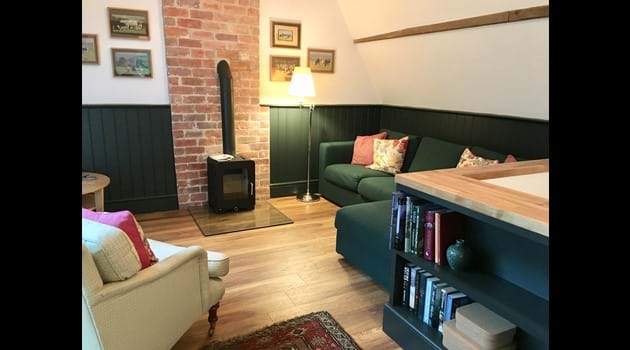 Corner sofa next to the log-burner