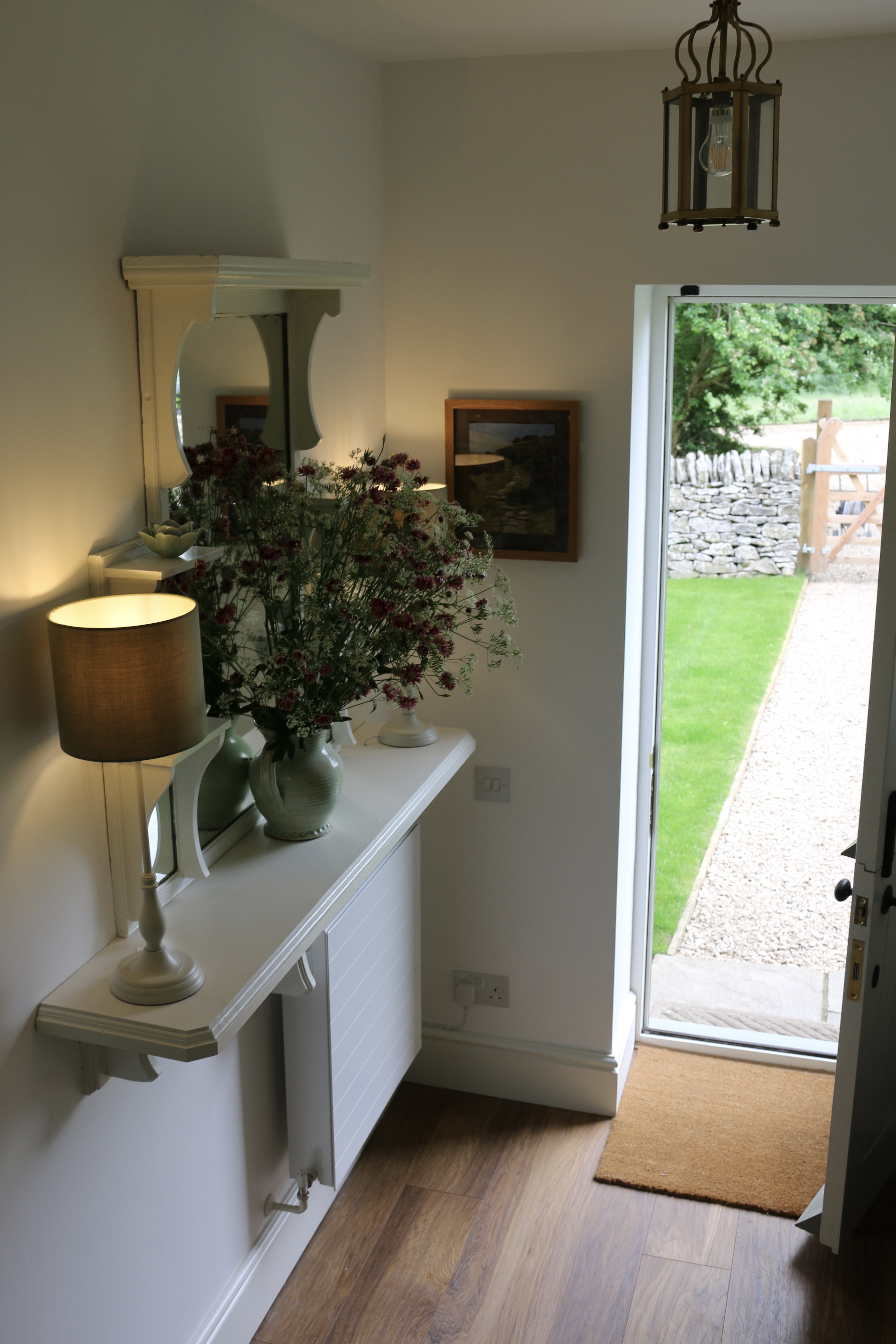 The entrance hall with coat-hanging under the stairs