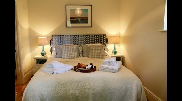 Master bedroom with kingsize bed