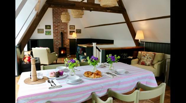 The light, open living/kitchen/dining room