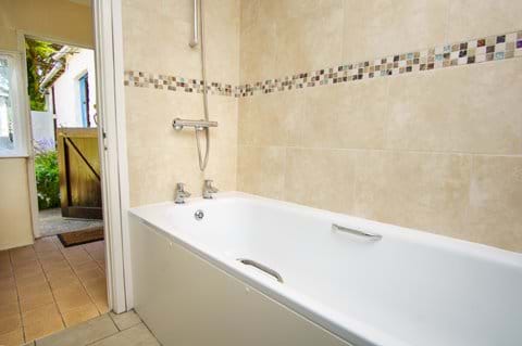 Fully fitted bathroom with Shower over bath