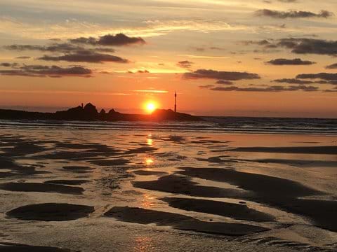 Not to be missed.  The sun setting over the Breakwater, Bude