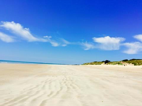 Expansive white sandy beaches of the Atlantic coast.