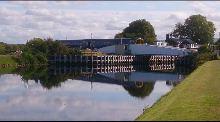 Caledonian canal swing bridge and train