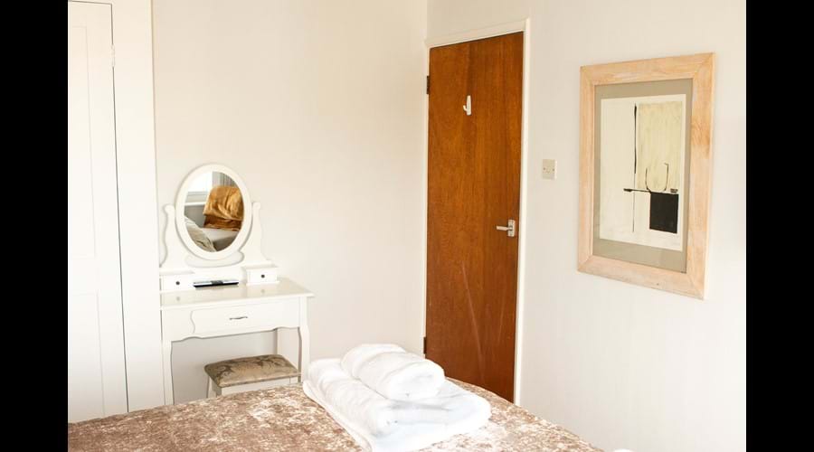 Top floor front bedroom has a dressing table to sit at. So who IS the fairest one of all?