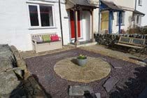 Paved garden at the front of the property