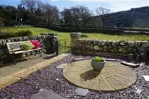 Paved garden at the front of the property